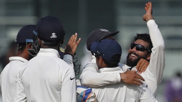 India's captain Virat Kohli, right, and Umesh Yadav celebrate the dismissal of England's Adil Rashid during their fifth day of the fifth cricket test match in Chennai, India, Tuesday, Dec. 20, 2016. (AP Photo/Tsering Topgyal)