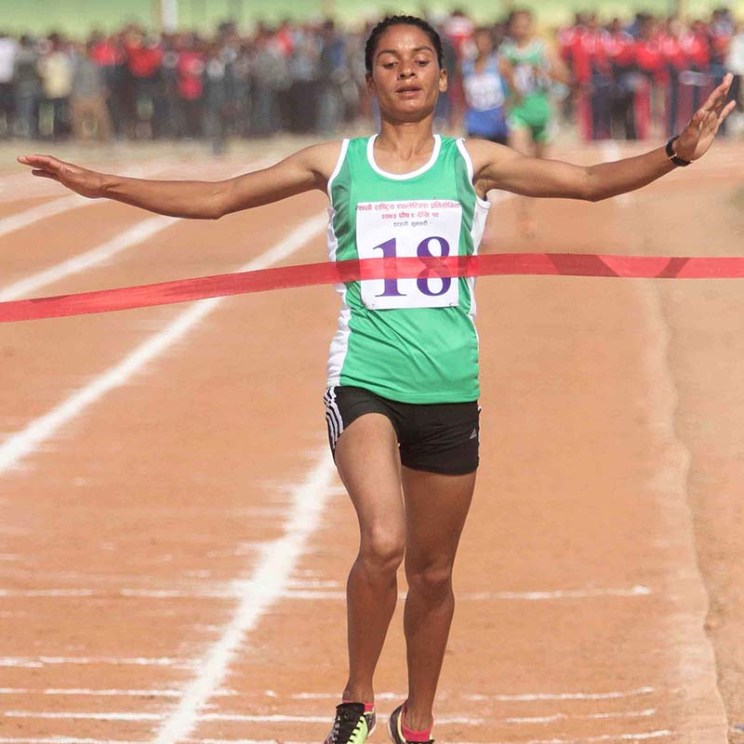 Saraswati Bhattarai of the Tribhuvan Army Club approaches at finish line in women's 1500m race during the 7th National Games at the Itahari Rangasala in Sunsari, on Saturday, December 24, 2016. Photo: Udipt Singh Chhetry/THT